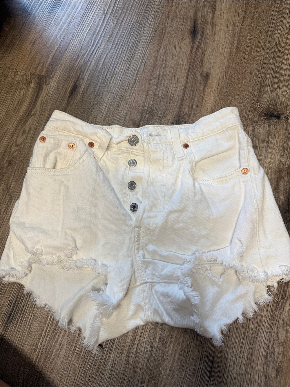 Levi’s Distressed White Denim Shorts